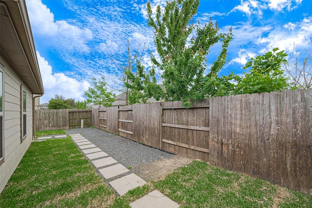 view of yard with a fenced backyard