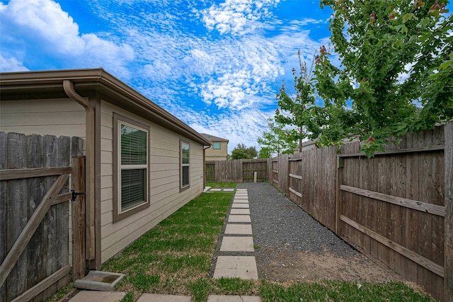 view of yard with a fenced backyard