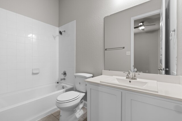 32734 Harvest Valley Dr, Brookshire, TX 77423 - full bath featuring toilet, shower / bathtub combination, vanity, a textured wall, and tile patterned floors