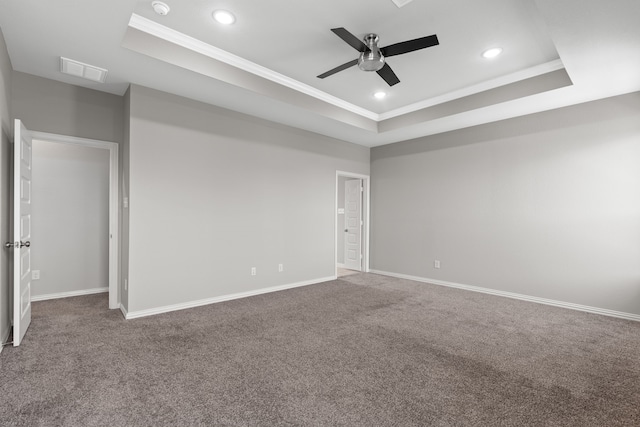 32734 Harvest Valley Dr, Brookshire, TX 77423 - carpeted spare room with a tray ceiling, a ceiling fan, crown molding, recessed lighting, and baseboards