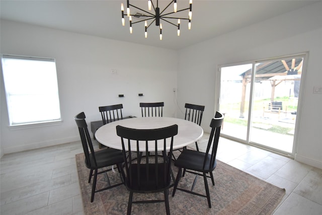 42 County Road 5102l, Cleveland, TX 77327 - dining space with healthy amount of natural light, a chandelier, and baseboards
