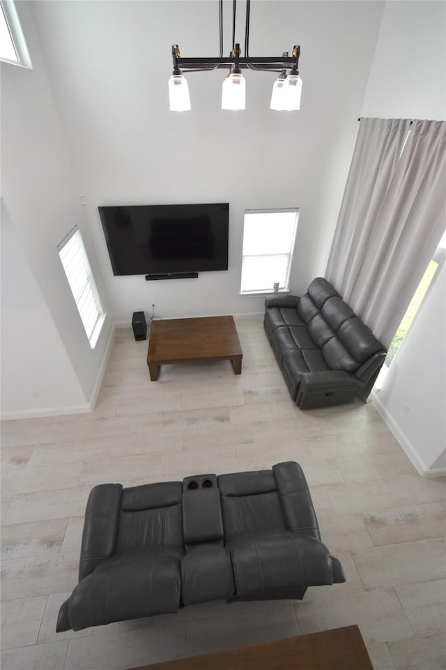 42 County Road 5102l, Cleveland, TX 77327 - living room featuring baseboards and a high ceiling