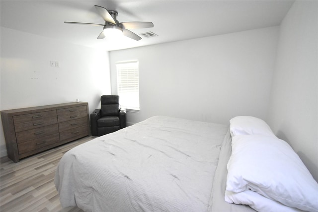 42 County Road 5102l, Cleveland, TX 77327 - bedroom featuring light wood-style flooring and a ceiling fan
