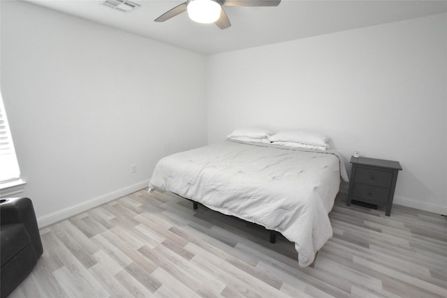 42 County Road 5102l, Cleveland, TX 77327 - bedroom with baseboards, wood finished floors, and ceiling fan