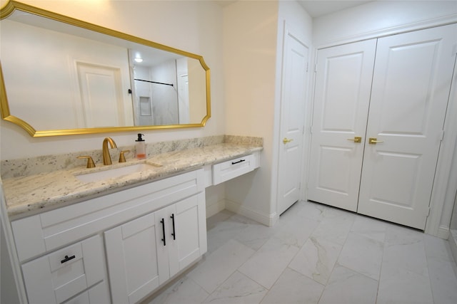 42 County Road 5102l, Cleveland, TX 77327 - bathroom with marble look tiles, vanity, and baseboards