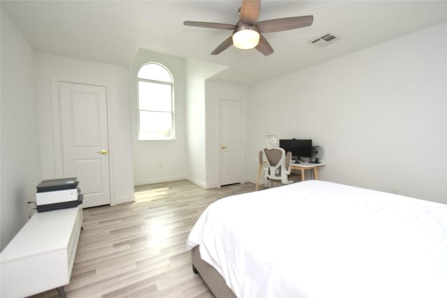 42 County Road 5102l, Cleveland, TX 77327 - bedroom featuring light wood-style flooring, a ceiling fan, and baseboards