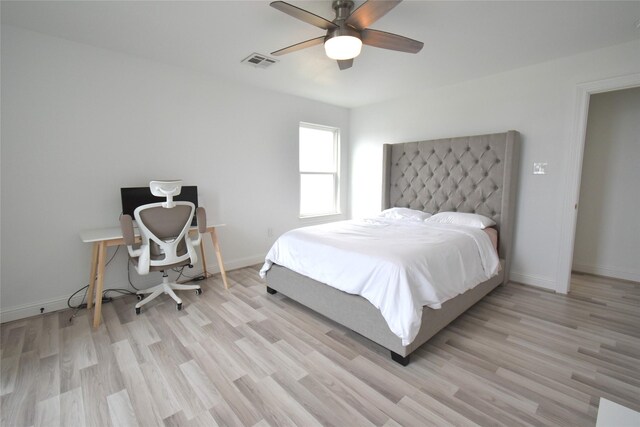 42 County Road 5102l, Cleveland, TX 77327 - bedroom featuring light wood finished floors, baseboards, and a ceiling fan