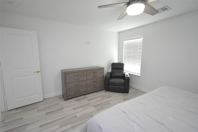 42 County Road 5102l, Cleveland, TX 77327 - bedroom with baseboards, light wood finished floors, and a ceiling fan