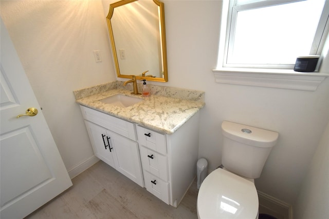 42 County Road 5102l, Cleveland, TX 77327 - half bath with vanity, toilet, and baseboards