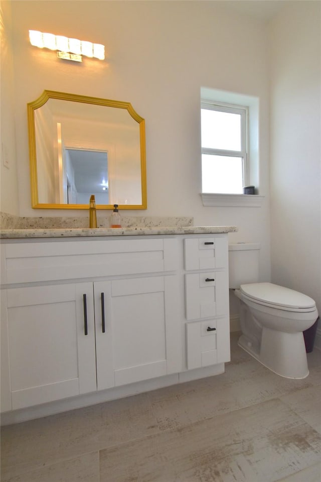 42 County Road 5102l, Cleveland, TX 77327 - bathroom featuring vanity and toilet