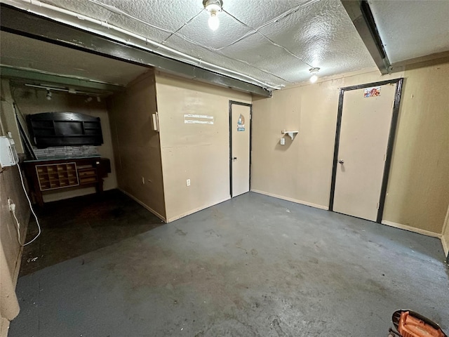 unfinished below grade area featuring baseboards