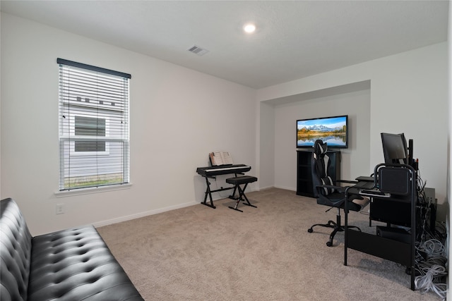 office area with visible vents, carpet flooring, and baseboards