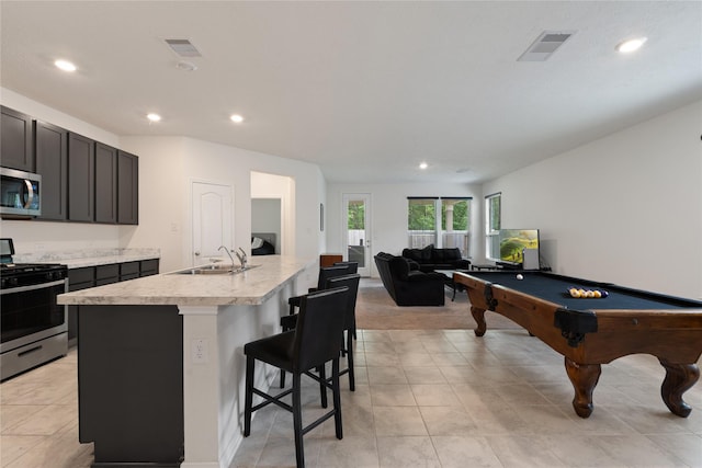 interior space with a sink, visible vents, recessed lighting, light countertops, and appliances with stainless steel finishes