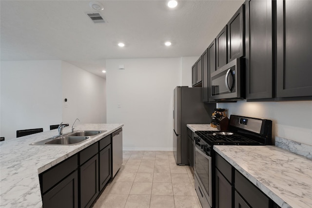 kitchen featuring a sink, light countertops, appliances with stainless steel finishes, visible vents, and recessed lighting