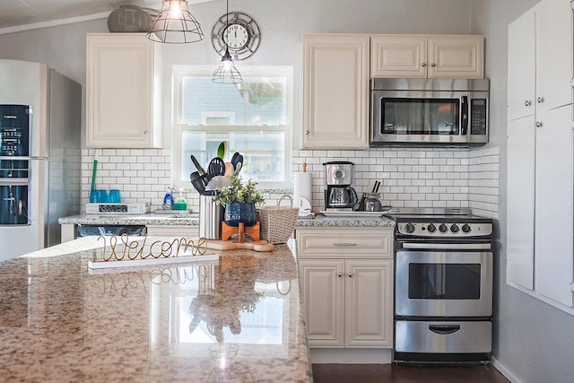 16519 Mansvelt Rd, Jamaica Beach, TX 77554 - kitchen with baseboards, decorative backsplash, white cabinets, light stone countertops, and appliances with stainless steel finishes