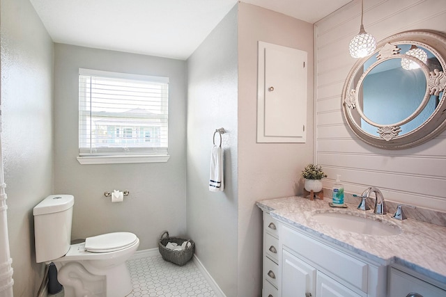 16519 Mansvelt Rd, Jamaica Beach, TX 77554 - half bathroom featuring baseboards, toilet, vanity, and tile patterned floors