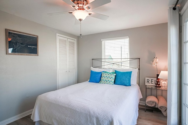 16519 Mansvelt Rd, Jamaica Beach, TX 77554 - bedroom featuring a closet, baseboards, wood finished floors, and a ceiling fan