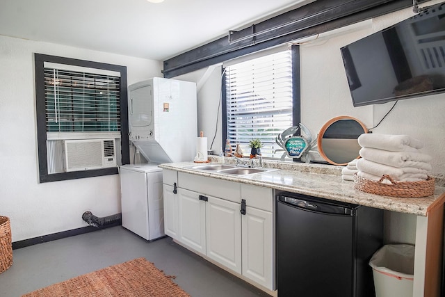 16519 Mansvelt Rd, Jamaica Beach, TX 77554 - kitchen featuring stacked washer and dryer, a sink, dishwashing machine, white cabinets, and concrete flooring