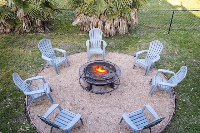 16519 Mansvelt Rd, Jamaica Beach, TX 77554 - view of yard featuring a fire pit, fence, and a patio area