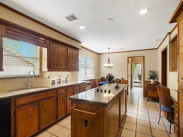 16707 Rugby Ct, Spring, TX 77379 - kitchen with a sink, a center island, black appliances, ornamental molding, and tasteful backsplash