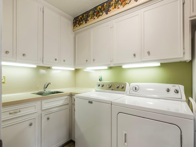 16707 Rugby Ct, Spring, TX 77379 - laundry area featuring washer and dryer and cabinet space