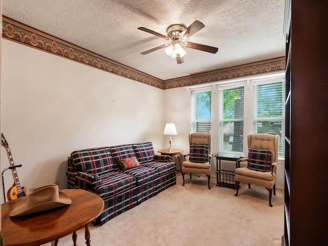 16707 Rugby Ct, Spring, TX 77379 - living area with a textured ceiling, a ceiling fan, and light colored carpet