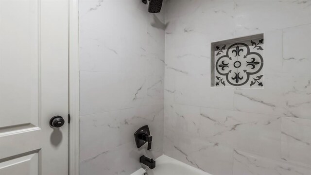 interior details with shower / bath combination
