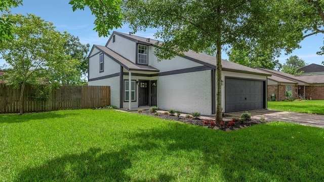 view of front of property featuring fence, driveway, a front lawn, brick siding, and a garage