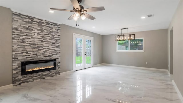 unfurnished living room with french doors, a fireplace, marble finish floor, baseboards, and visible vents