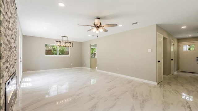 spare room with recessed lighting, baseboards, marble finish floor, visible vents, and a ceiling fan