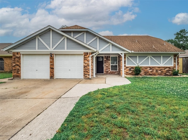 1701 N Park Way Dr, Deer Park, TX 77536 - view of front of house with an attached garage, brick siding, driveway, a front yard, and a shingled roof