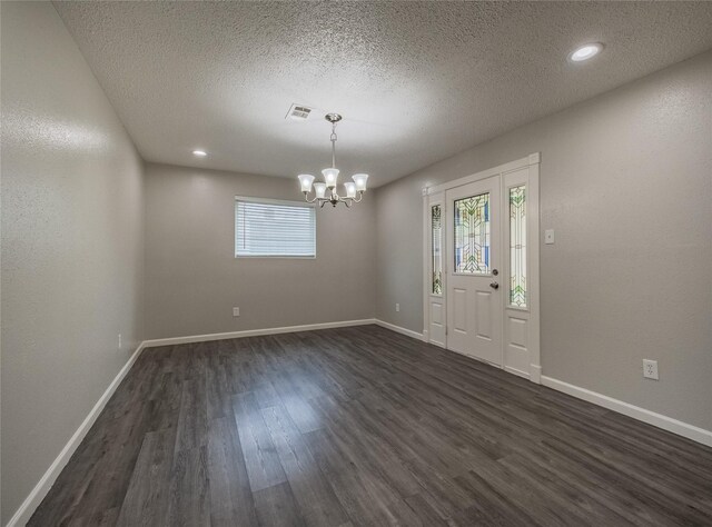 1701 N Park Way Dr, Deer Park, TX 77536 - foyer with a chandelier, dark wood-style flooring, a textured ceiling, baseboards, and recessed lighting