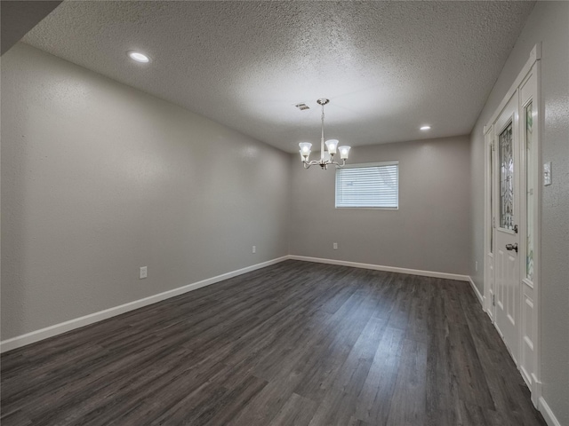 1701 N Park Way Dr, Deer Park, TX 77536 - empty room featuring a chandelier, dark wood-style flooring, a textured ceiling, baseboards, and recessed lighting