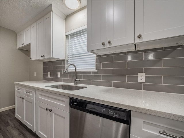 1701 N Park Way Dr, Deer Park, TX 77536 - kitchen with stainless steel dishwasher, a sink, white cabinets, tasteful backsplash, and dark wood-type flooring