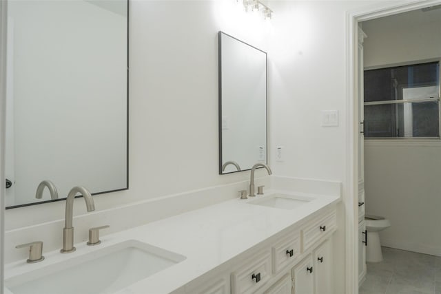 18007 Ravenfield Dr, Houston, TX 77084 - full bathroom featuring toilet, a sink, double vanity, and tile patterned flooring