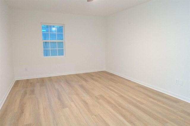 18007 Ravenfield Dr, Houston, TX 77084 - spare room with baseboards, ceiling fan, and light wood-style floors