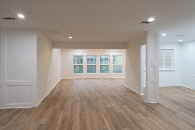 18007 Ravenfield Dr, Houston, TX 77084 - empty room with visible vents, wood finished floors, and recessed lighting