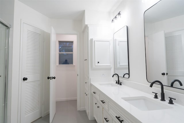 18007 Ravenfield Dr, Houston, TX 77084 - full bathroom featuring double vanity, a sink, baseboards, and tile patterned flooring