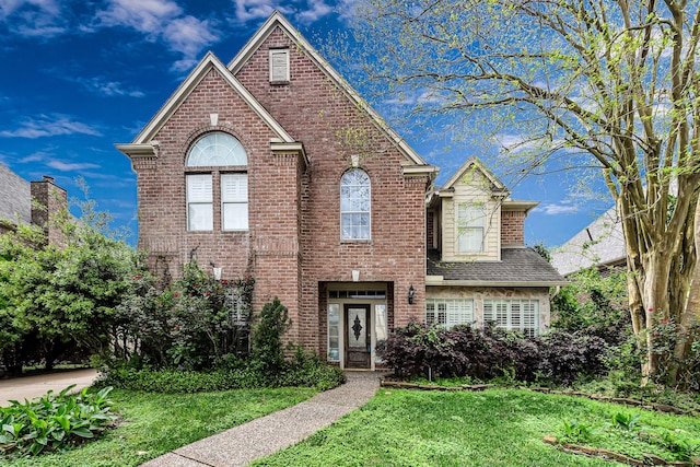 2926 Deer Creek Dr, Sugar Land, TX 77478 - view of front of house with brick siding and a front lawn