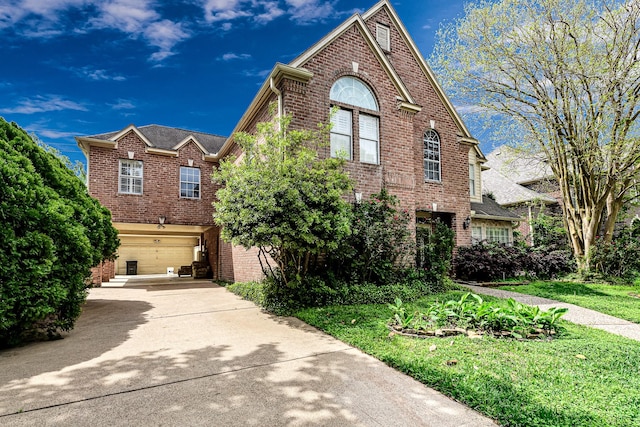 2926 Deer Creek Dr, Sugar Land, TX 77478 - traditional-style home featuring brick siding, an attached garage, and concrete driveway