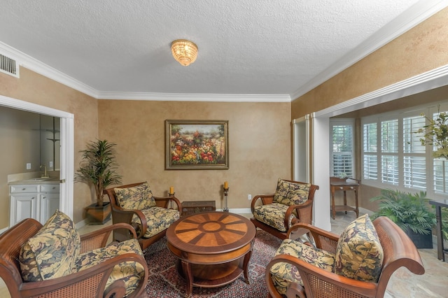 2926 Deer Creek Dr, Sugar Land, TX 77478 - sitting room featuring crown molding, a textured ceiling, and baseboards