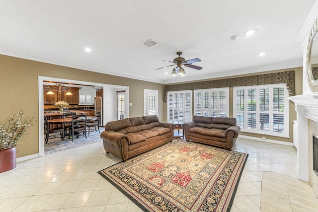 2926 Deer Creek Dr, Sugar Land, TX 77478 - living area featuring light tile patterned floors, ornamental molding, a ceiling fan, a fireplace, and recessed lighting