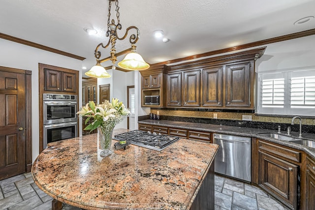 2926 Deer Creek Dr, Sugar Land, TX 77478 - kitchen featuring appliances with stainless steel finishes, stone tile floors, a sink, dark brown cabinetry, and crown molding
