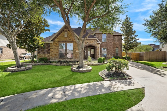 6123 Cameron Ct, League City, TX 77573 - view of front of property with stone siding, brick siding, fence, and a front lawn
