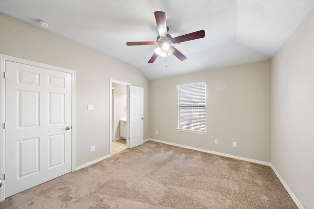 6123 Cameron Ct, League City, TX 77573 - unfurnished bedroom featuring ensuite bathroom, light carpet, baseboards, and vaulted ceiling