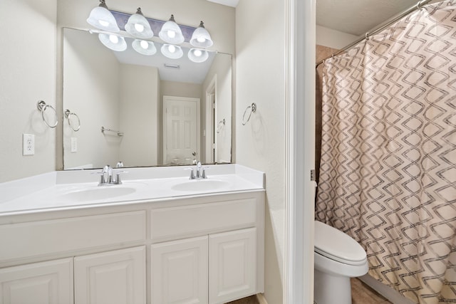 6123 Cameron Ct, League City, TX 77573 - bathroom featuring double vanity, visible vents, a sink, and toilet