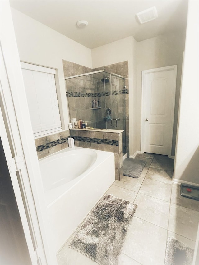 5114 Monarch Belle Ln, Katy, TX 77493 - bathroom with a stall shower, a garden tub, and tile patterned flooring