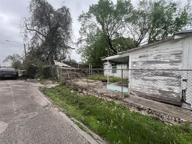 view of side of property with fence