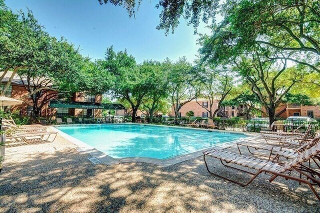 2255 Braeswood Park Dr Unit 294, Houston, TX 77030 - community pool featuring a patio