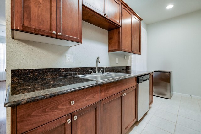 2255 Braeswood Park Dr Unit 294, Houston, TX 77030 - kitchen featuring dishwasher, a sink, baseboards, dark stone countertops, and recessed lighting